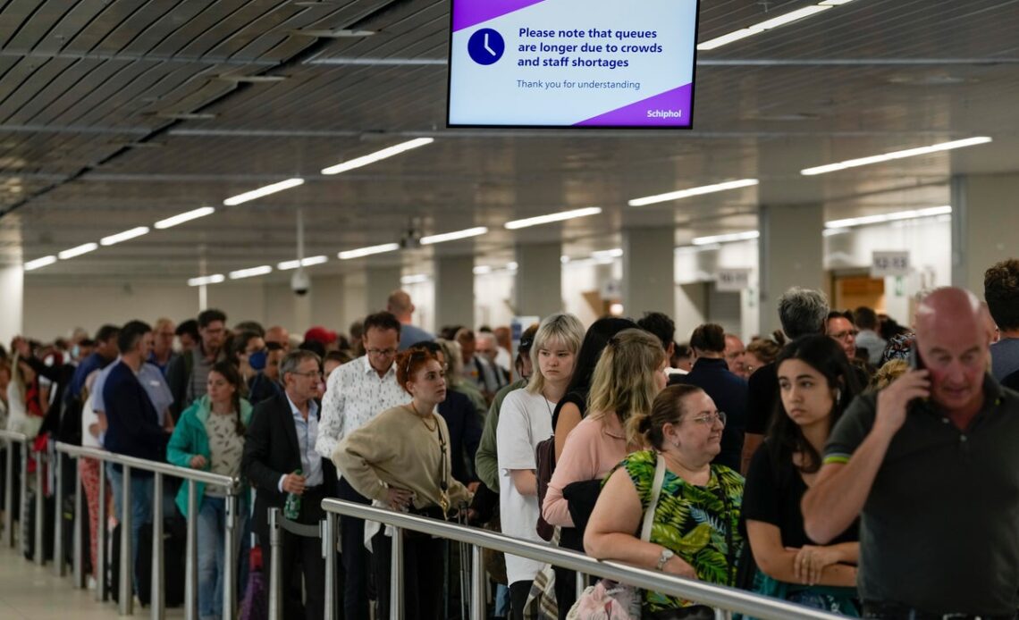 Amsterdam’s Schiphol airport tells passengers not to arrive more than four hours ahead of flights