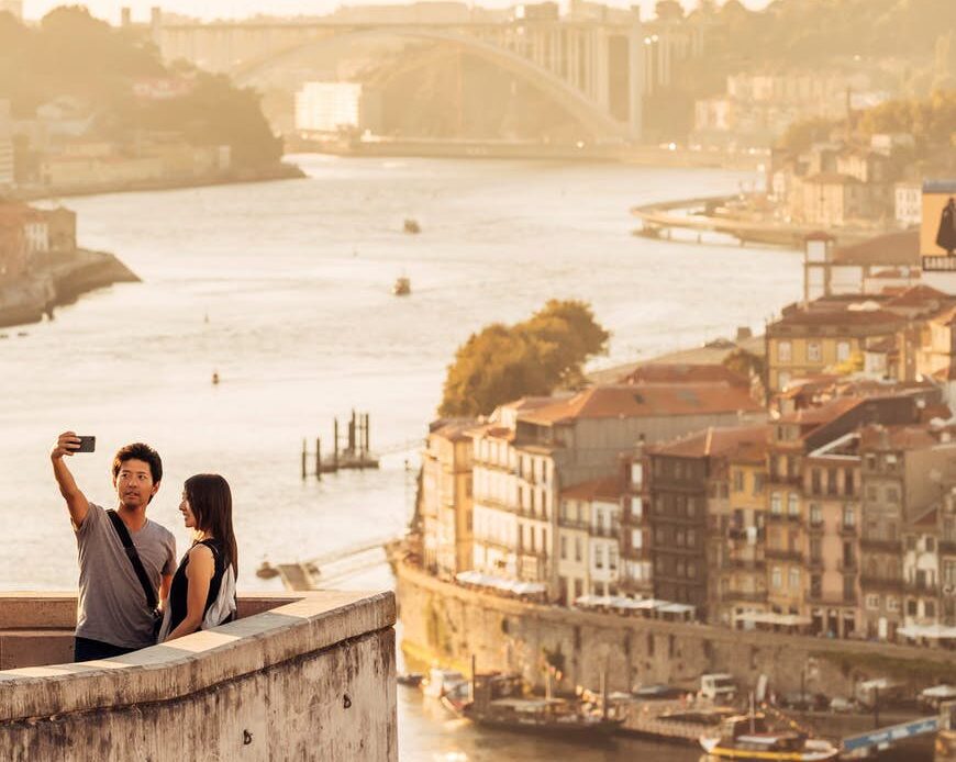 A couple takes a selfie at the Jardim do Morro in Porto