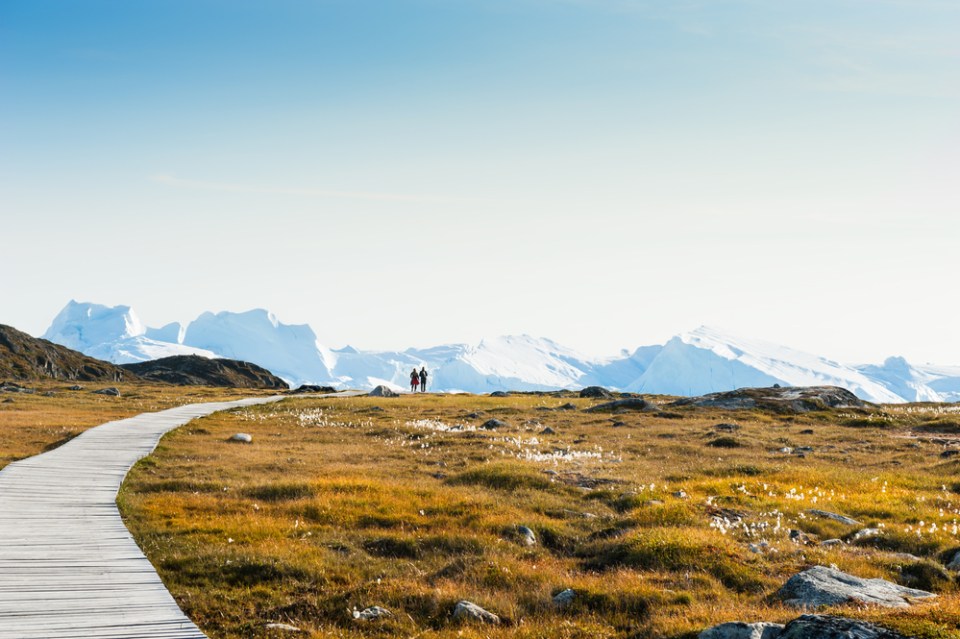 Tourists walking to the Ilulissat icefjord, western Greenland