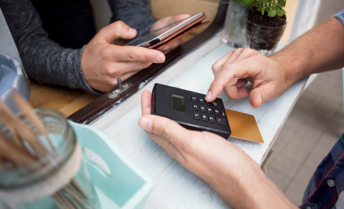 Is it worth it to pay with a rewards credit card even if it incurs fees?