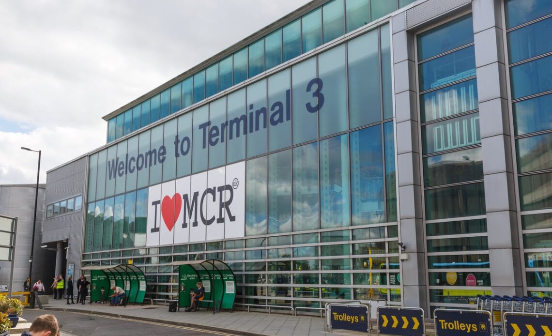 Passengers filmed crawling along conveyor belt to retrieve luggage at Manchester Airport