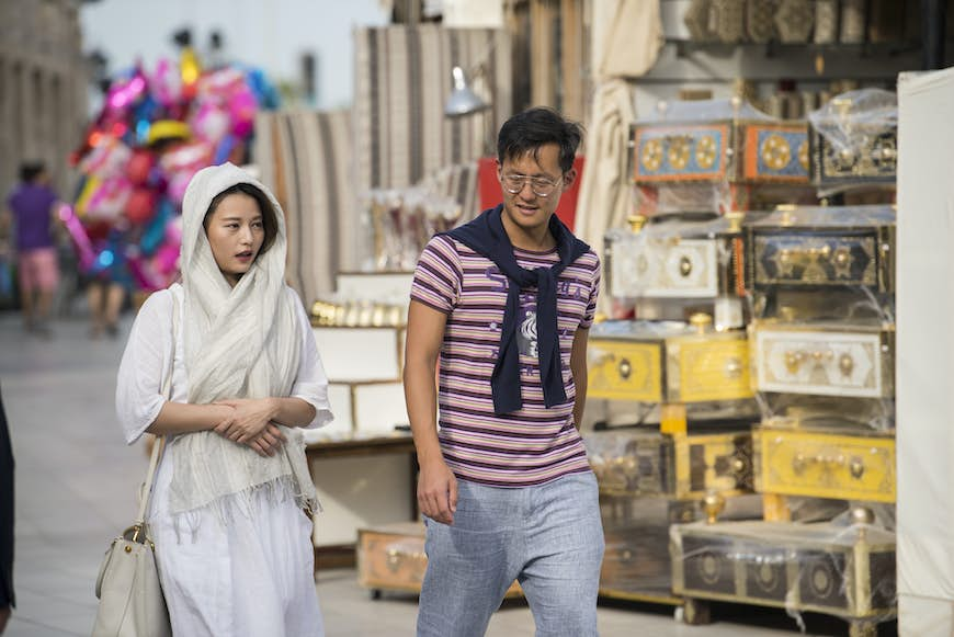 Tourists tour the old market of Souk Waqif, Doha, Qatar, Middle East