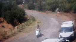 Tourist rides moped around Pompeii