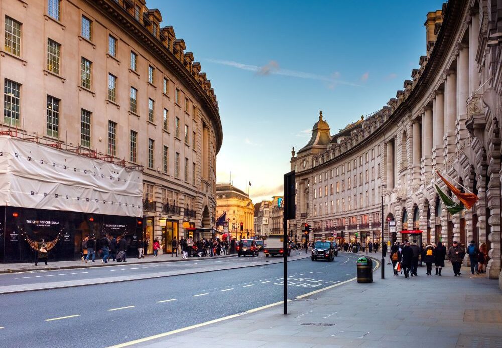 Photo of people walking in the street of London