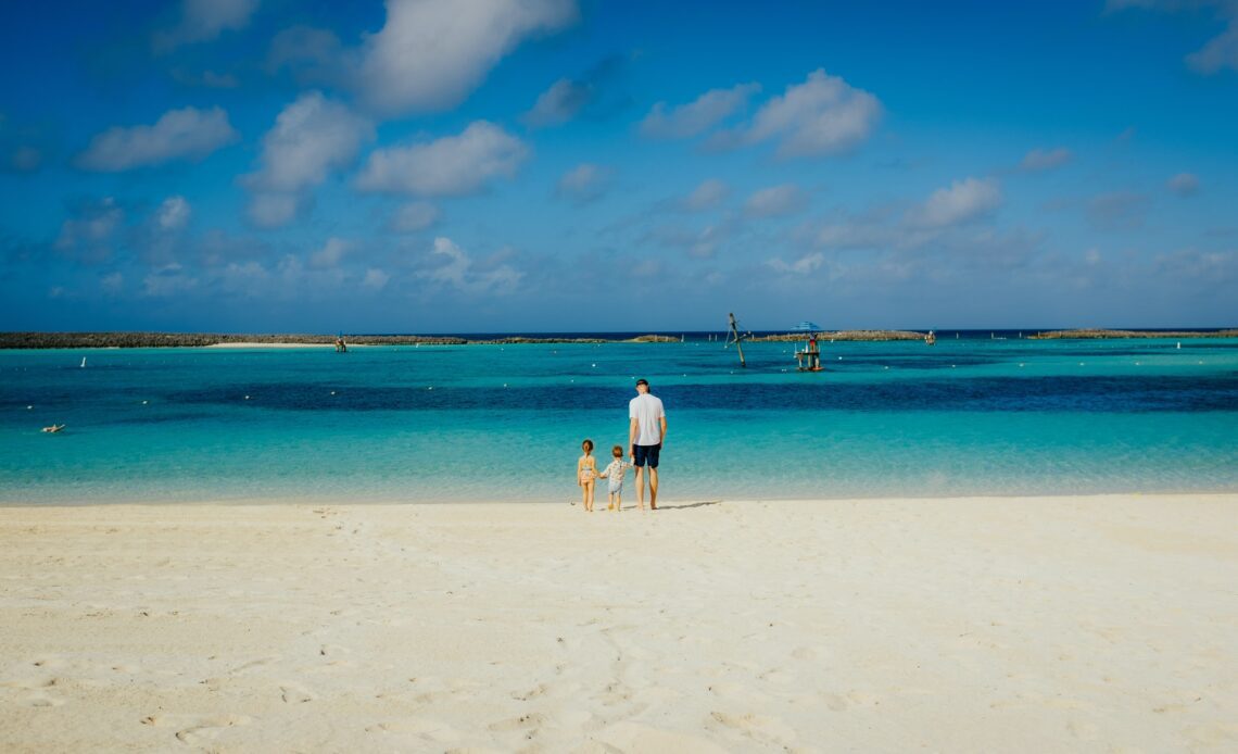 Family on the beach in The Bahamas (photo: Trent Erwin)