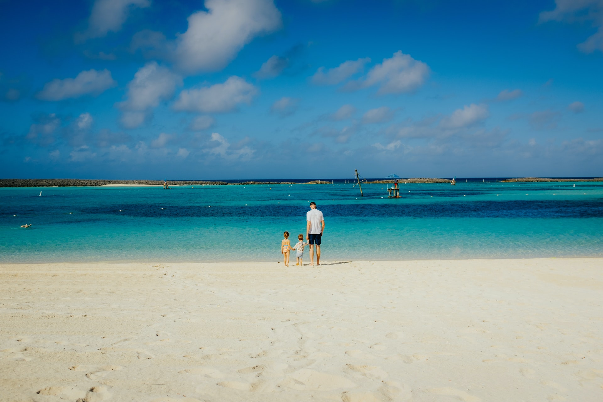 Family on the beach in The Bahamas (photo: Trent Erwin)