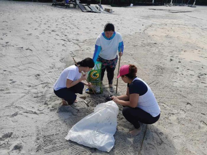 Coastal cleanup participants from Pico de Loro Beach and Country Club and Pico Sands Hotel team members at Santelmo Cove.