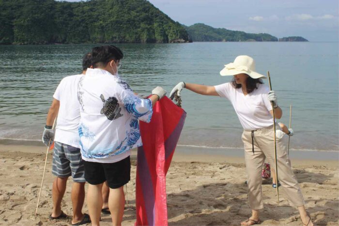 Coastal cleanup participants from Pico de Loro Beach and Country Club and Pico Sands Hotel select guests at Pico Beach.