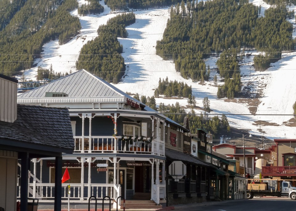 Streets of Jackson Hole with ski slopes at background