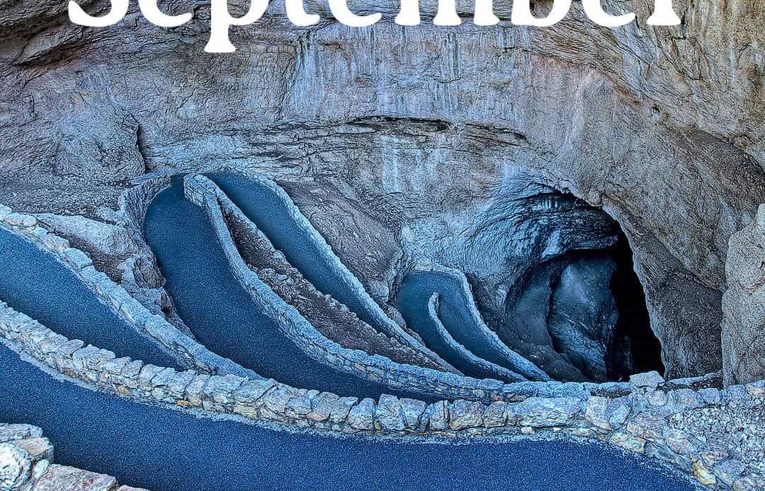 17 best national parks in september title over photo of Carlsbad Cavern Natural Entrance