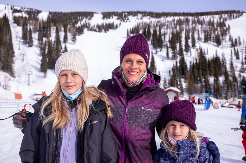 people standing on snowy mountains