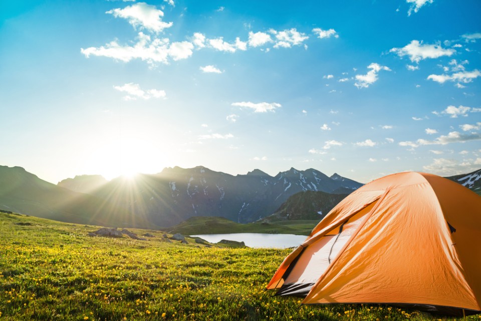 tourist tent camping in mountains