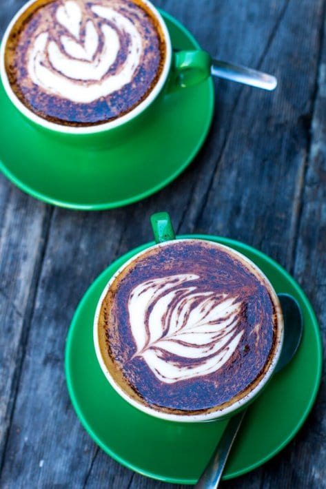 two cups of coffee on table