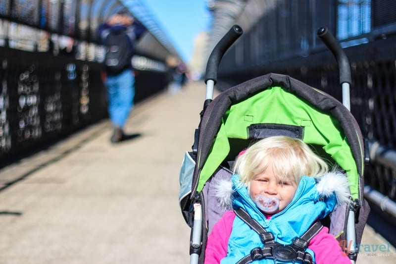 girl sitting in stroller on Sydney Harbour Bridge