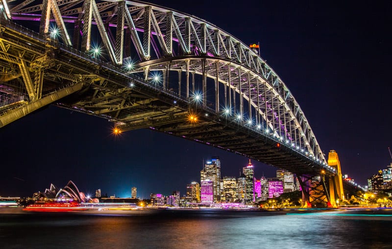 sydney harbor bridge lit up at night