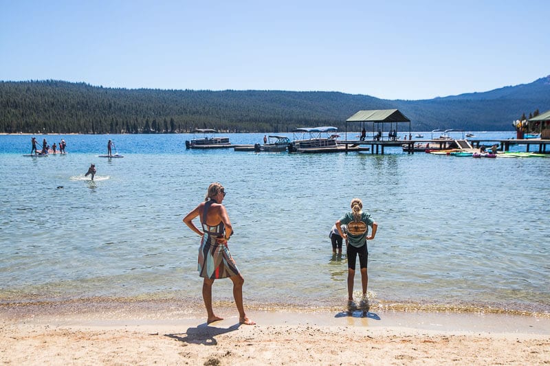 woman and girl standing on beach of Redfish Lake