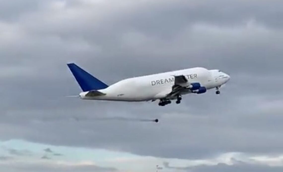 Moment a 100kg wheel falls off massive Boeing Dreamlifter jet