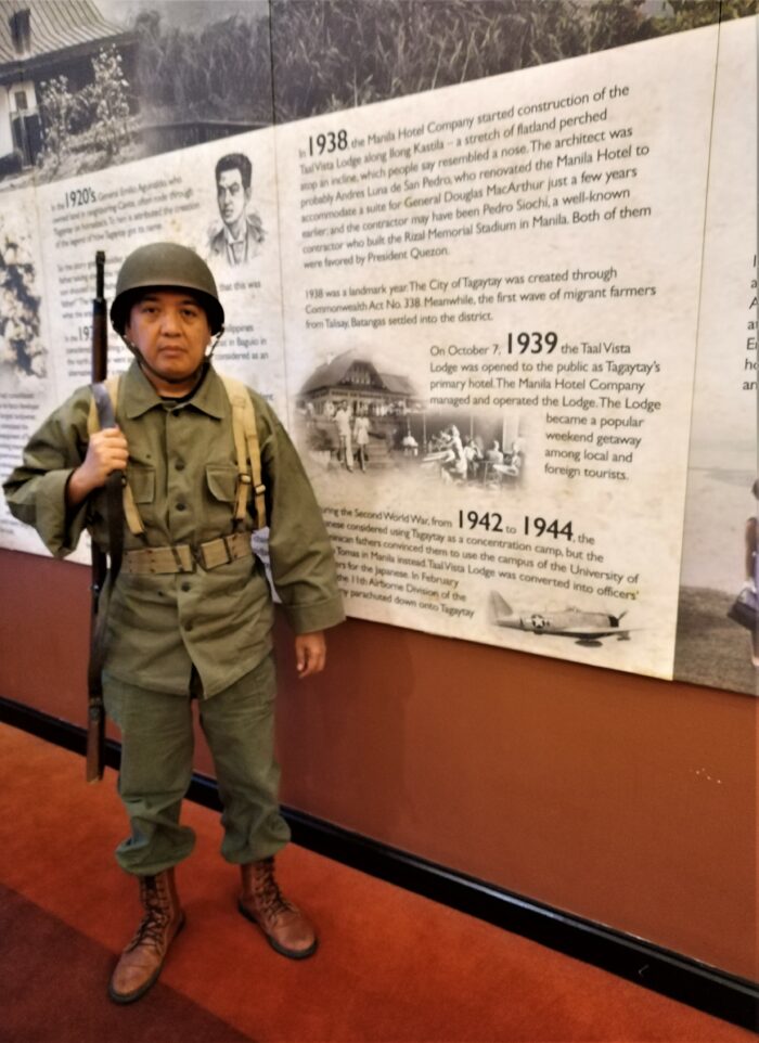 A World War 2 reenactor at Taal Vista's Walk Through Time history wall