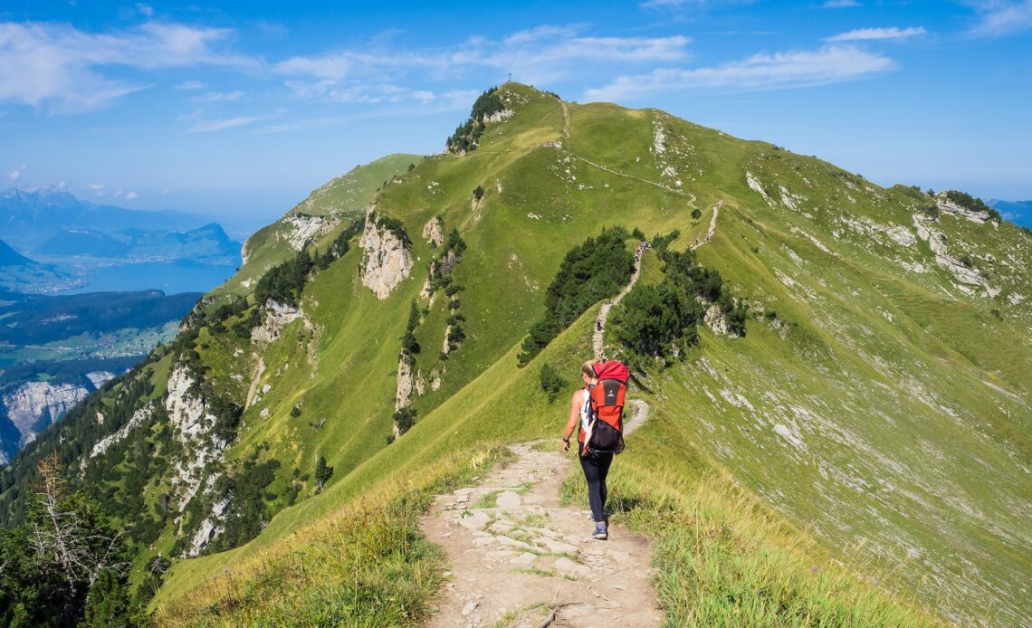 Woman backpacking in Stoos, Switzerland (photo: Ante Hamersmit)