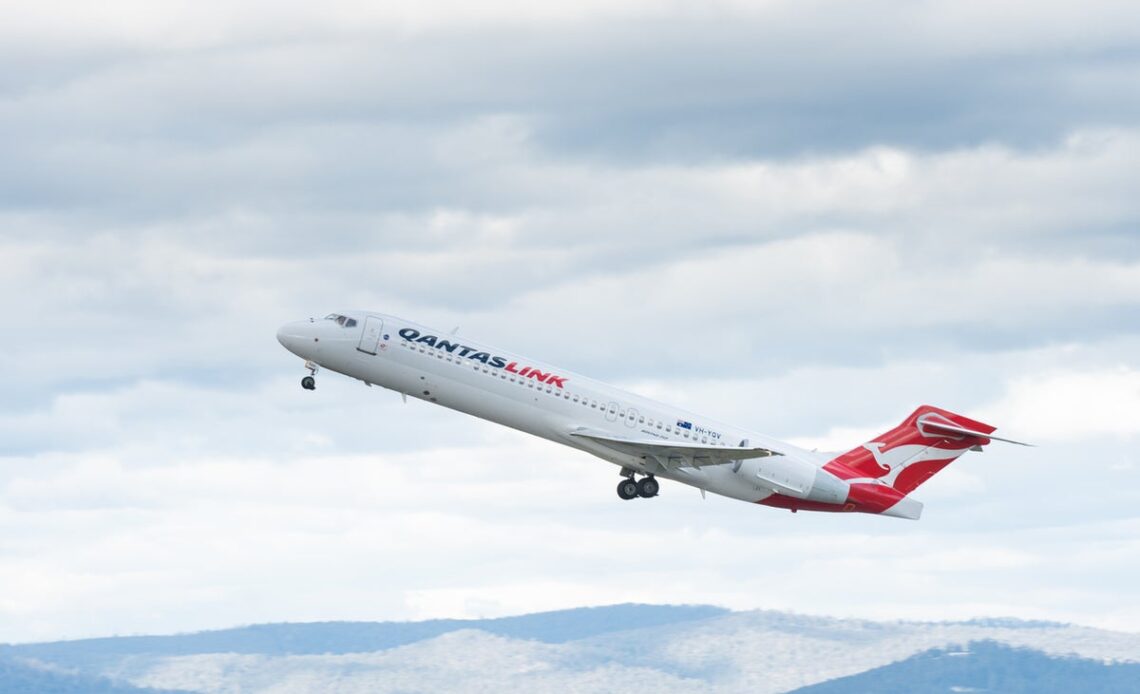 Qantaslink plane evacuated after catching fire at airport