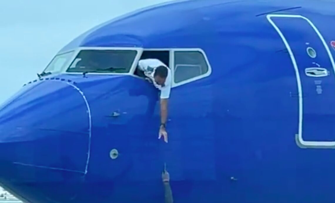 Southwest pilot dangles out of cockpit to try and reach passenger’s phone