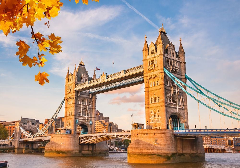 Tower bridge with autumn leaves in London.