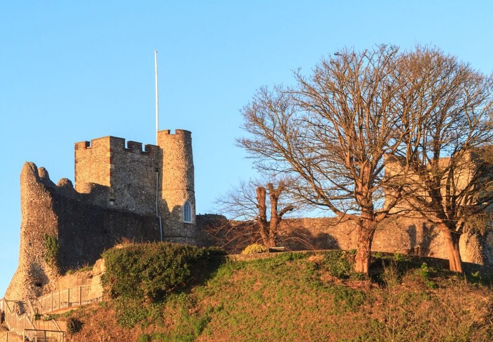 A stunning view of Lewes Castle in Sussex, UK, with a blue sky in the background. 