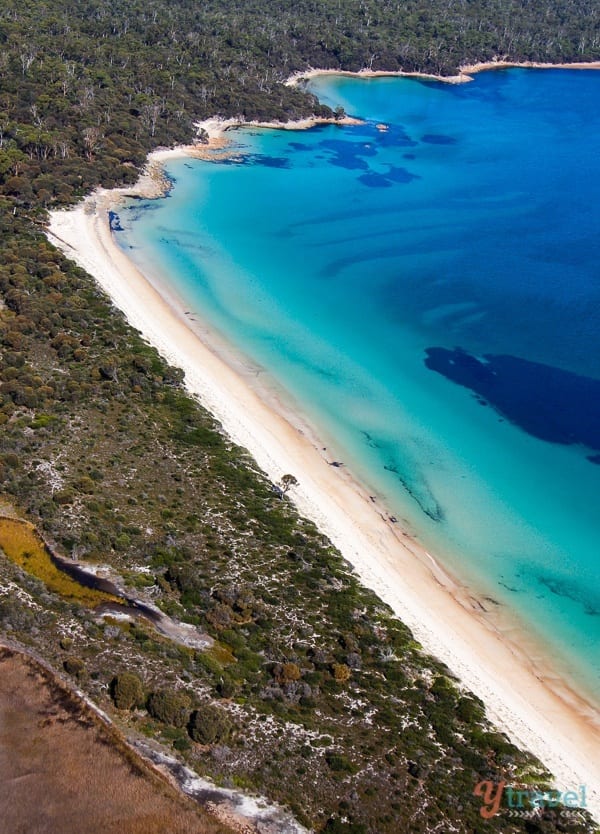 aerial view of the blue waters and white sand of of Hazards Beach, Freycinet National Park 