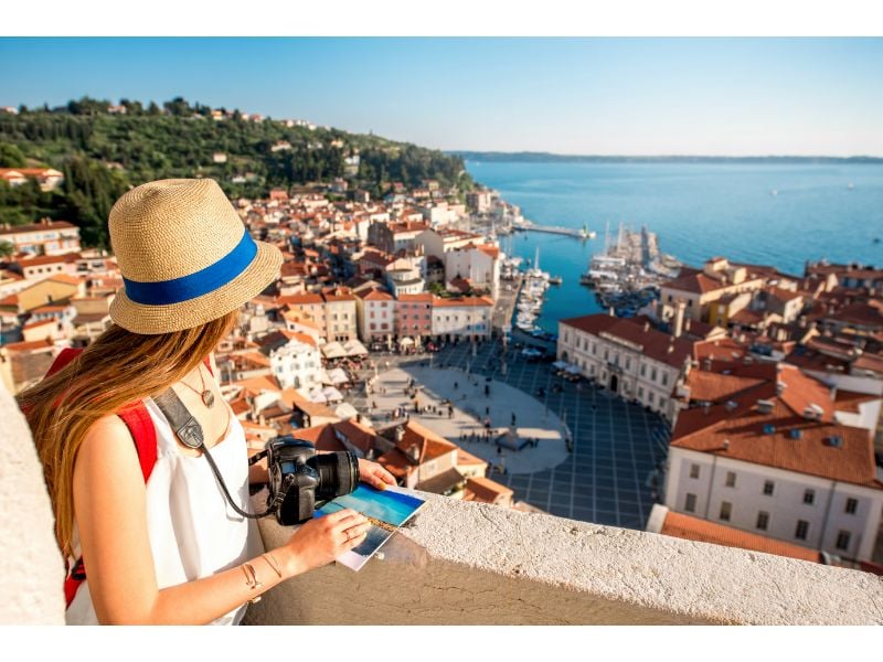 Female Traveler with Camera in Europe