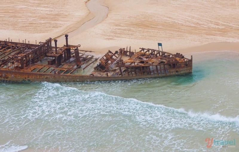 rusted shipwreck on beach fraser island 
