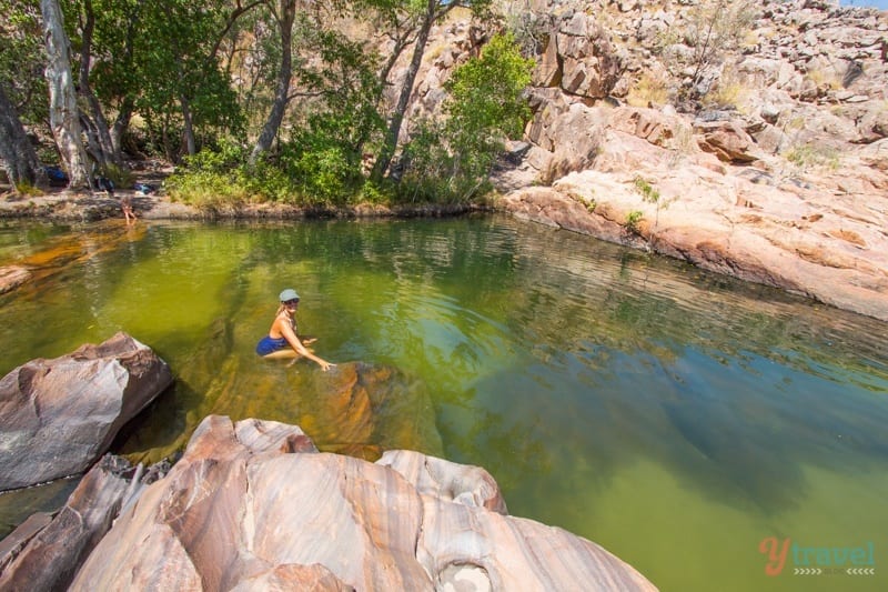 woman sitting in waterhole Kakadu National Park, Australia