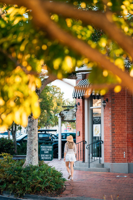 woman walking down pretty street