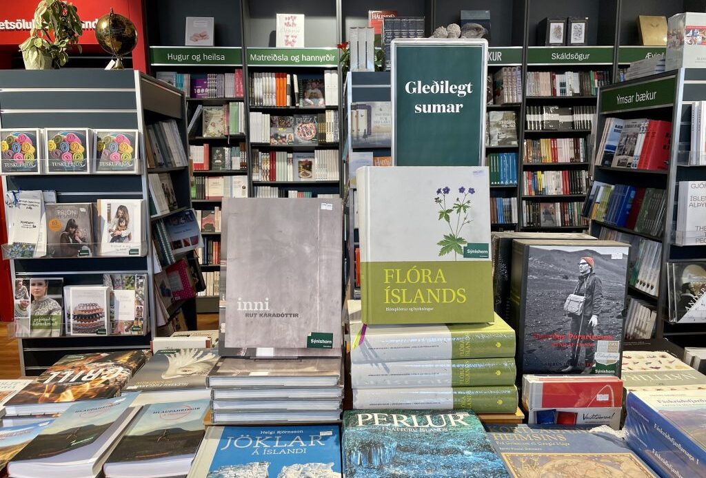 Piles of books about Iceland in an Icelandic bookstore.