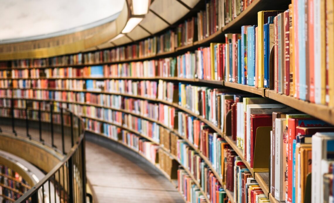 Curved shelves lined with books in a bookshop