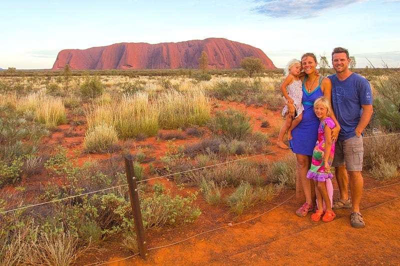 family posing inf ront of uluru