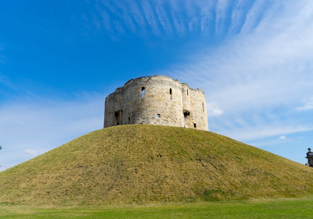 Cliffords Tower in York, England UK on a clear blue sky