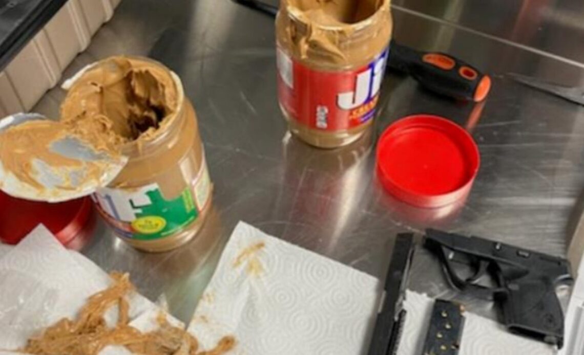 Man arrested after airport security finds gun parts smuggled in two jars of peanut butter