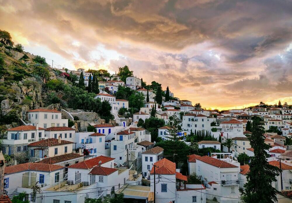 white buildings on the hill in Hydra Greek Islands