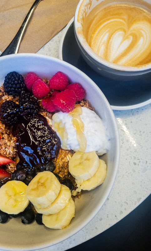 granola bowl and coffee on table