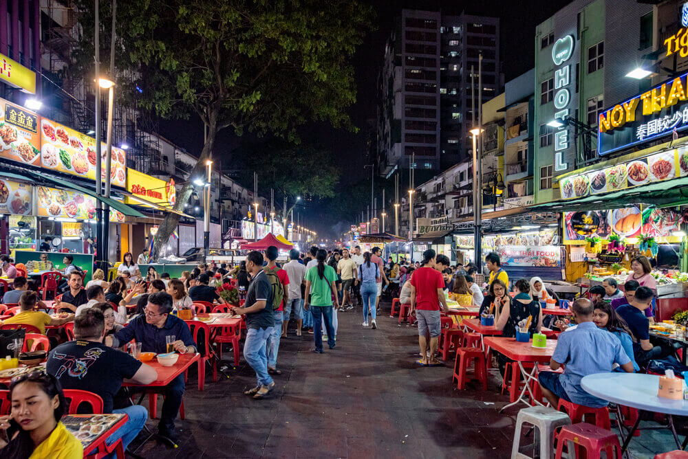 people eating at tables at Jalan Alor, Hawker Market
