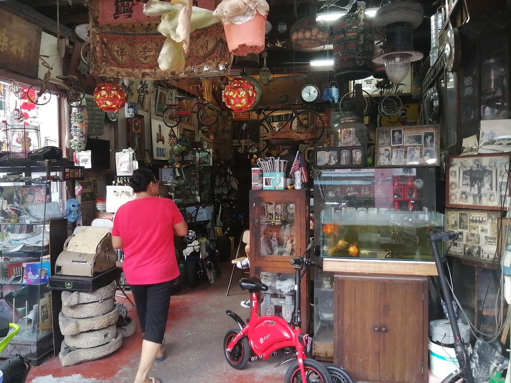 person in A typical shop in George Town, Penang