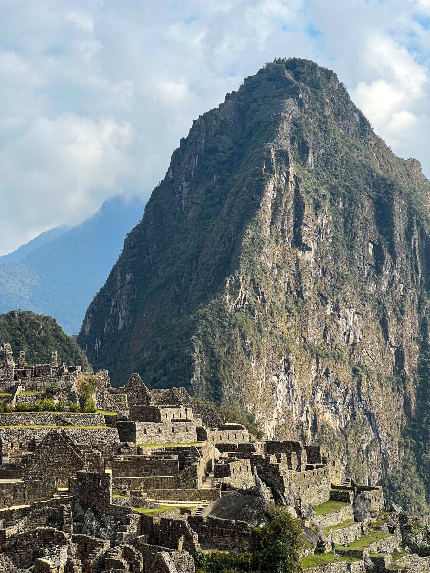 Huayna Picchu mountain towers over the ruins of Machu Picchu below (photo by Dave Lee)