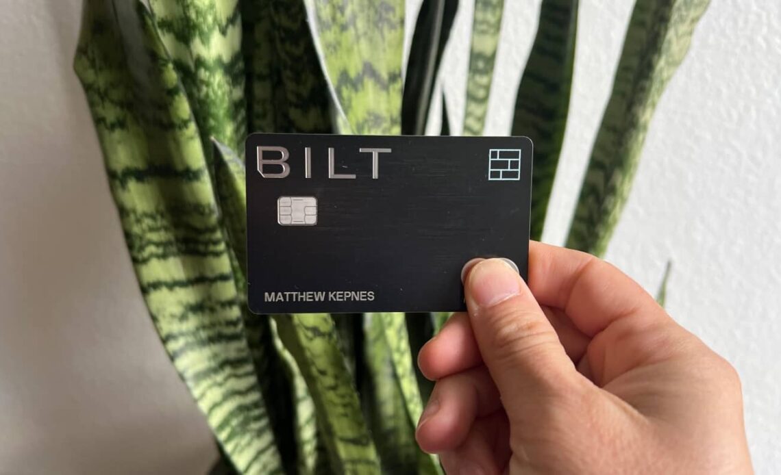 Nomadic Matt's new Bilt Mastercard being held up in front of a snake plant