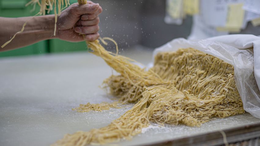 A worker prepares noodles at the Aberdeen Yau Kee Noodles Factory in Hong Kong on January 13, 2023.Credits: Noemi Cassanelli/CNN