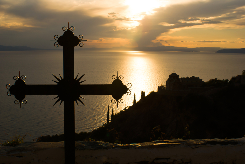 Cross at sunset on Mount Athos, Greece