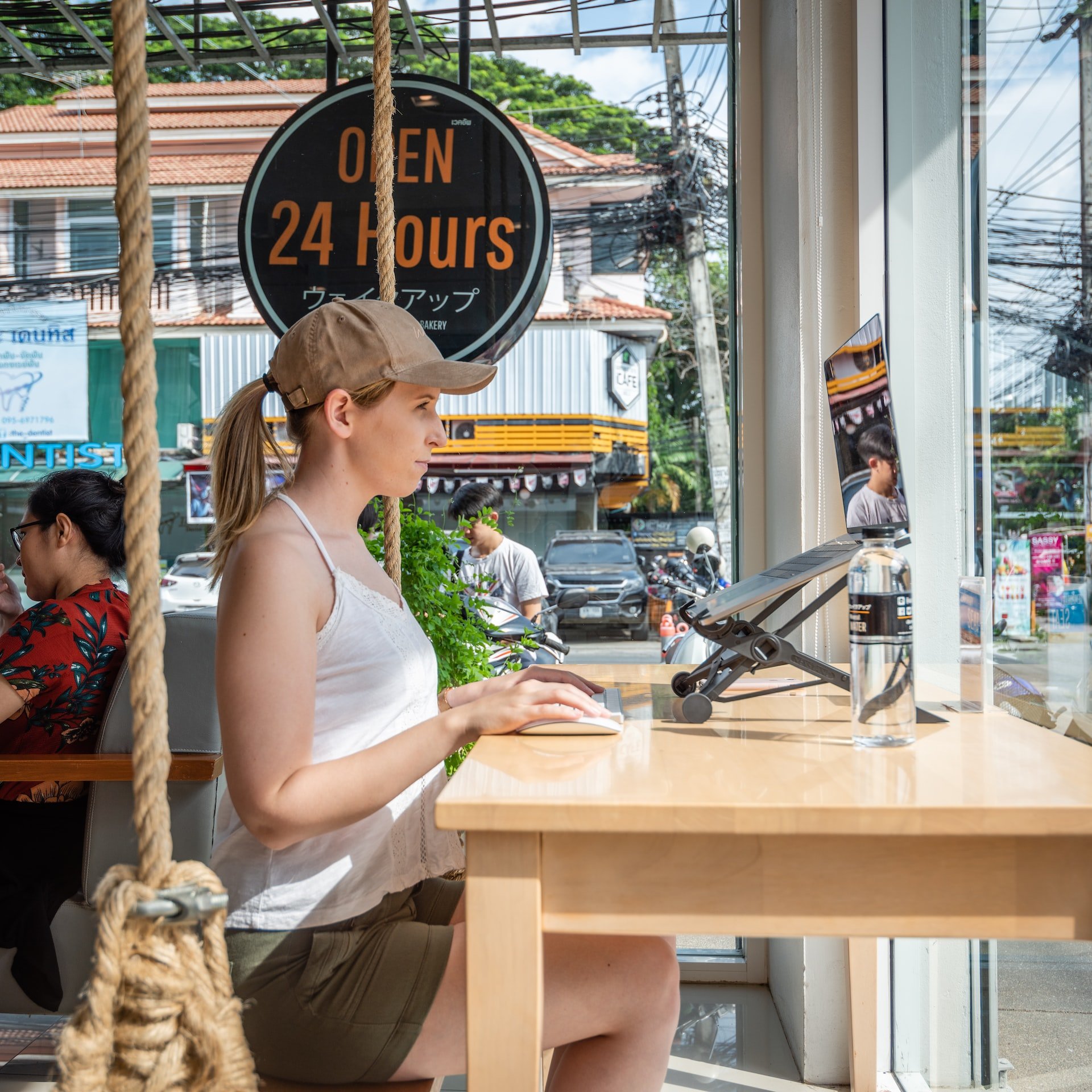 A woman working remotely in a cafe (photo: Samantha Eaton)