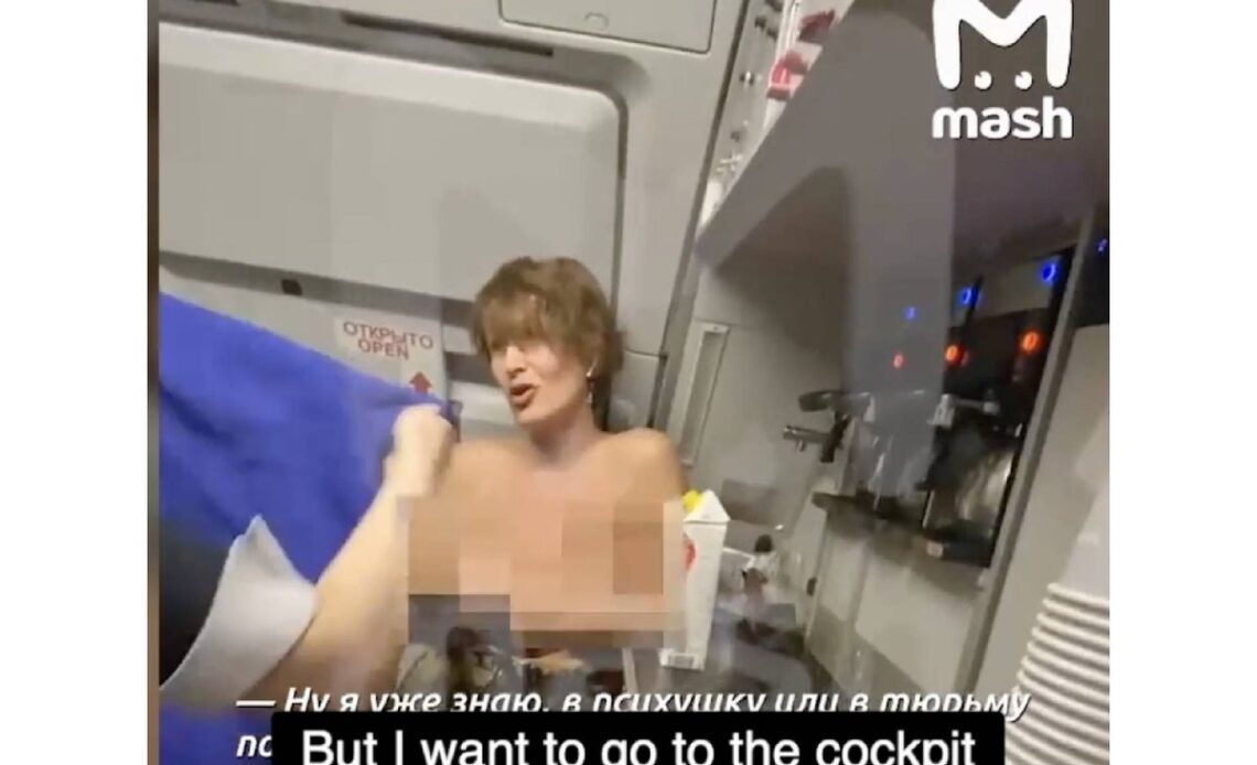 Topless Russian woman on flight demands entry to cockpit