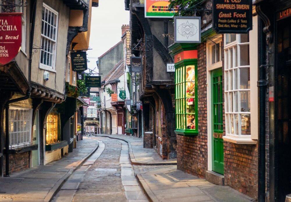 The Shambles in York, England, at early morning on the famously narrow medieval street in the historic center of York, filled with shops, pubs, and more!