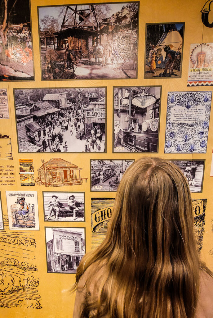 girl looking at history of knotts farm on wall mural