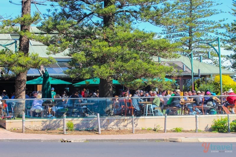 people sitting on deck of Byron Bay Beach Hotel, 